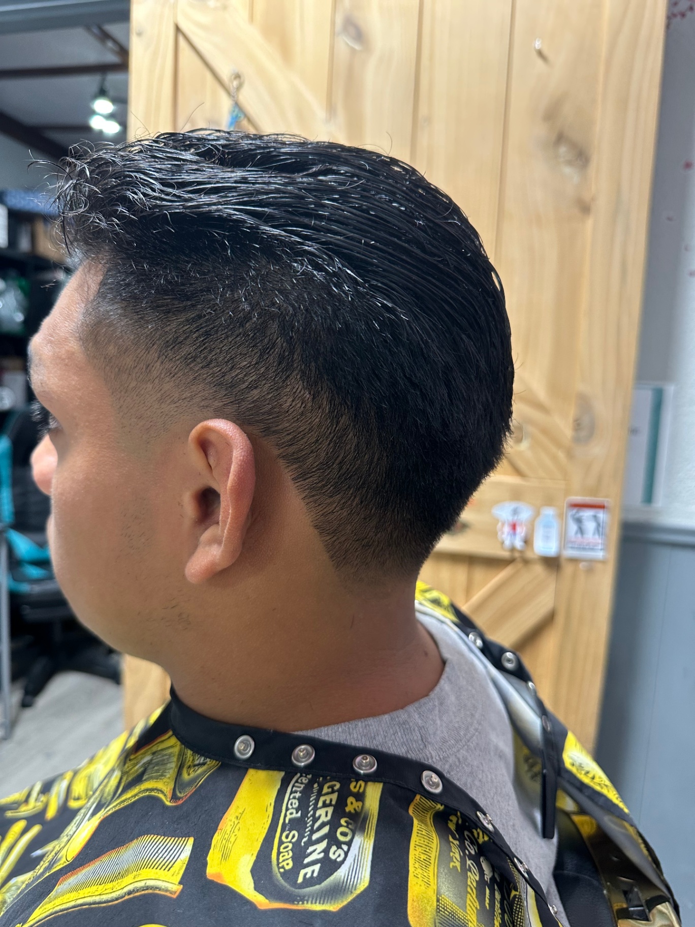 Slick back with mid skin fade