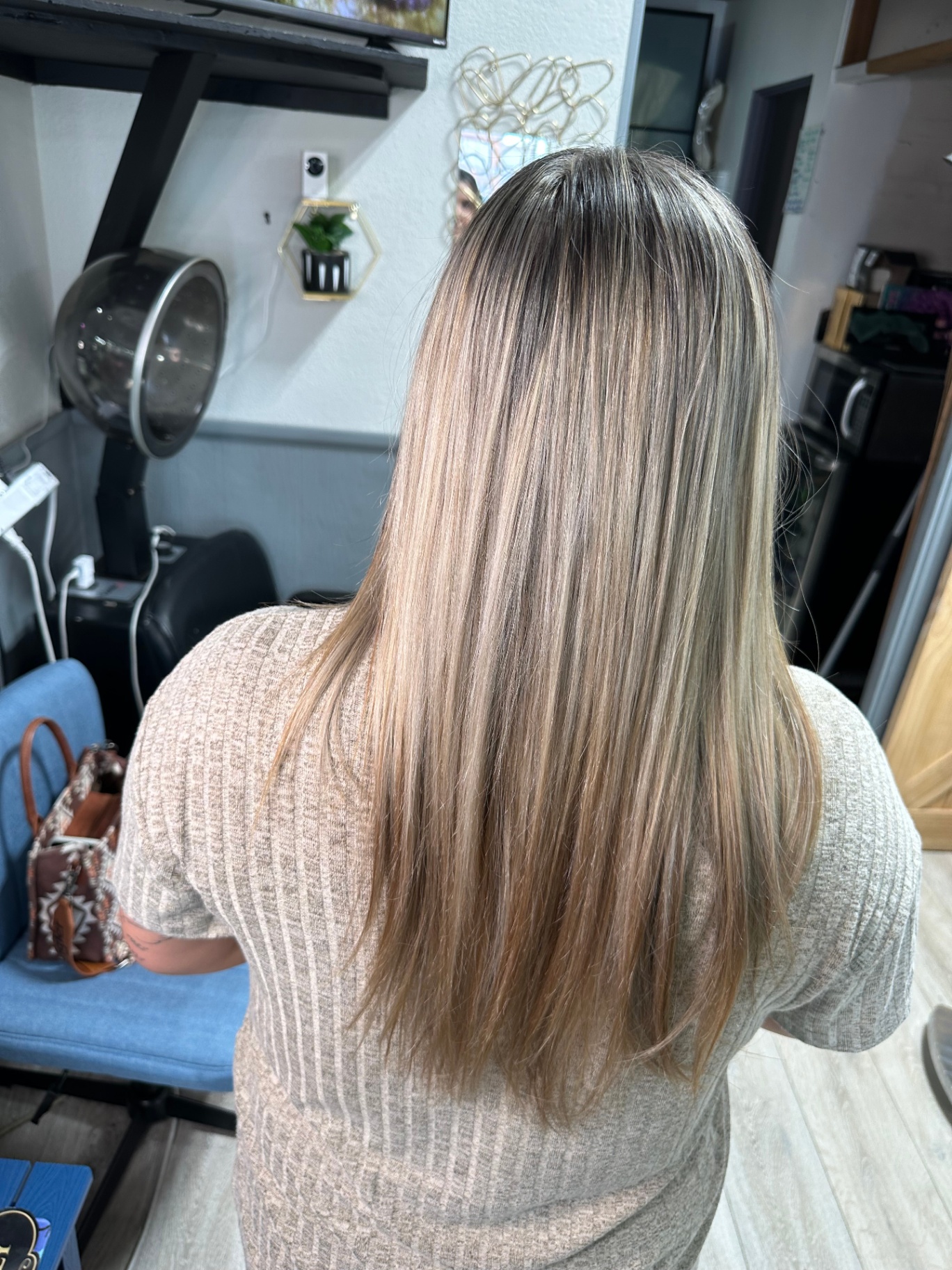 Blonde balayage on straight sleek finish