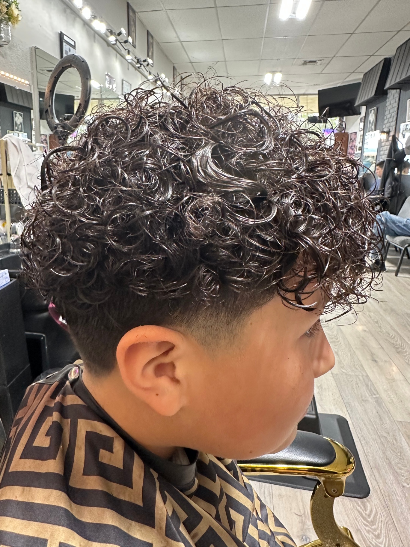 Curly top with low taper fade